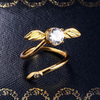 Adjustable Golden Snitch ring with a winged design and a clear stone, an included Harry Potter jewelry gift for fans RNGBX1