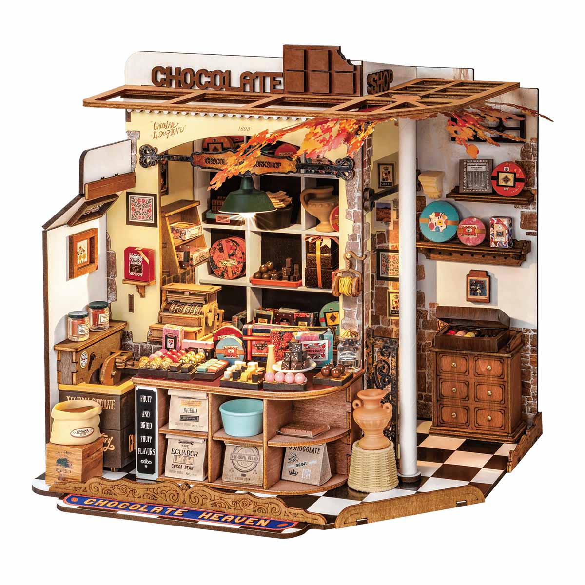 Finished miniature chocolate shop model with a wooden counter, vintage cash register and warm LED lit sweet displays for adults