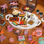 Tray of tiny chocolates, truffles and bonbons from a DIY miniature chocolate shop kit, a crafting gift for miniature collectors