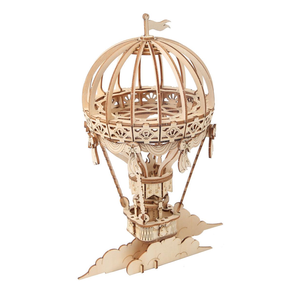 Wooden hot air balloon 3D puzzle kit assembled into a detailed plywood display model for teens and adult crafters
