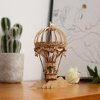 Handcrafted wooden hot air balloon model as shelf and desk decor for a home or office, a no glue DIY craft for adults