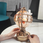 180 laser-cut wooden globe pieces that assemble into a lit world map model, a screen-free building hobby kit for adults