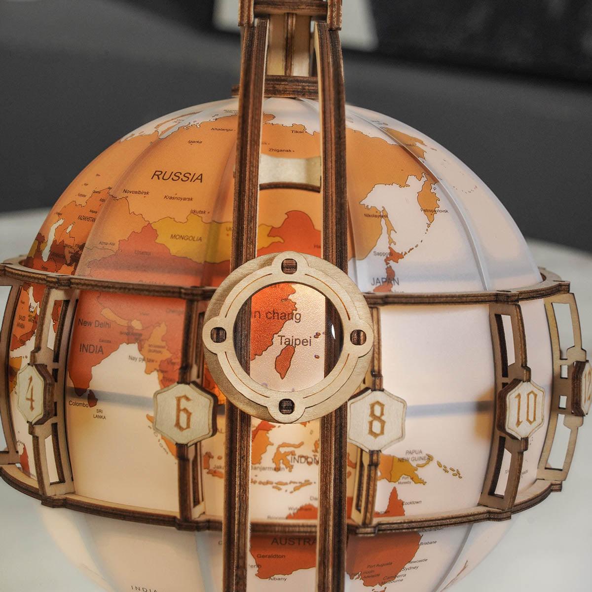 Assembled glowing globe puzzle that works as functional art and a warm night light for home office desks and bookshelves
