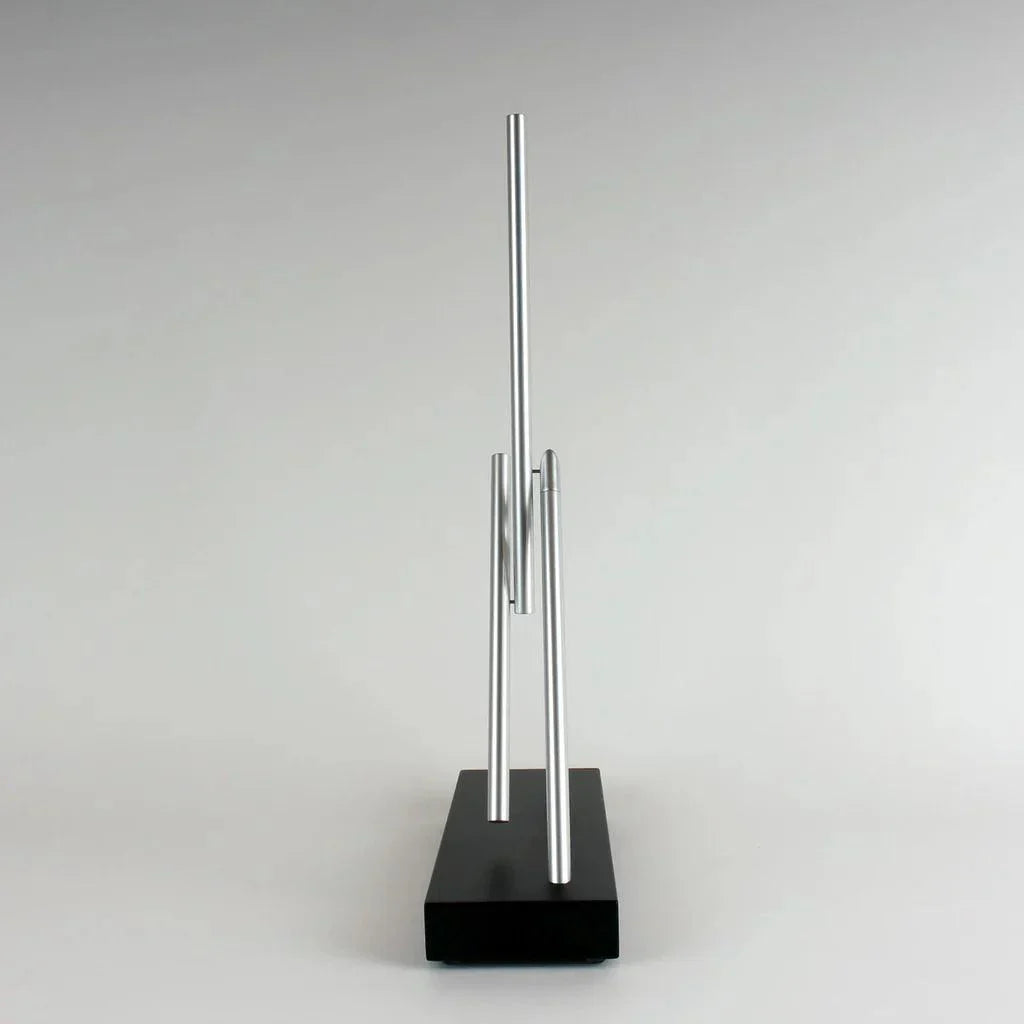 Kinetic energy sculpture with two balanced aluminum arms and a solid Black base, engineering desk art for a home office