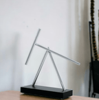 Iron Man fan gift and Marvel collectible swinging sticks sculpture with a Black base for a study, den, or reading room