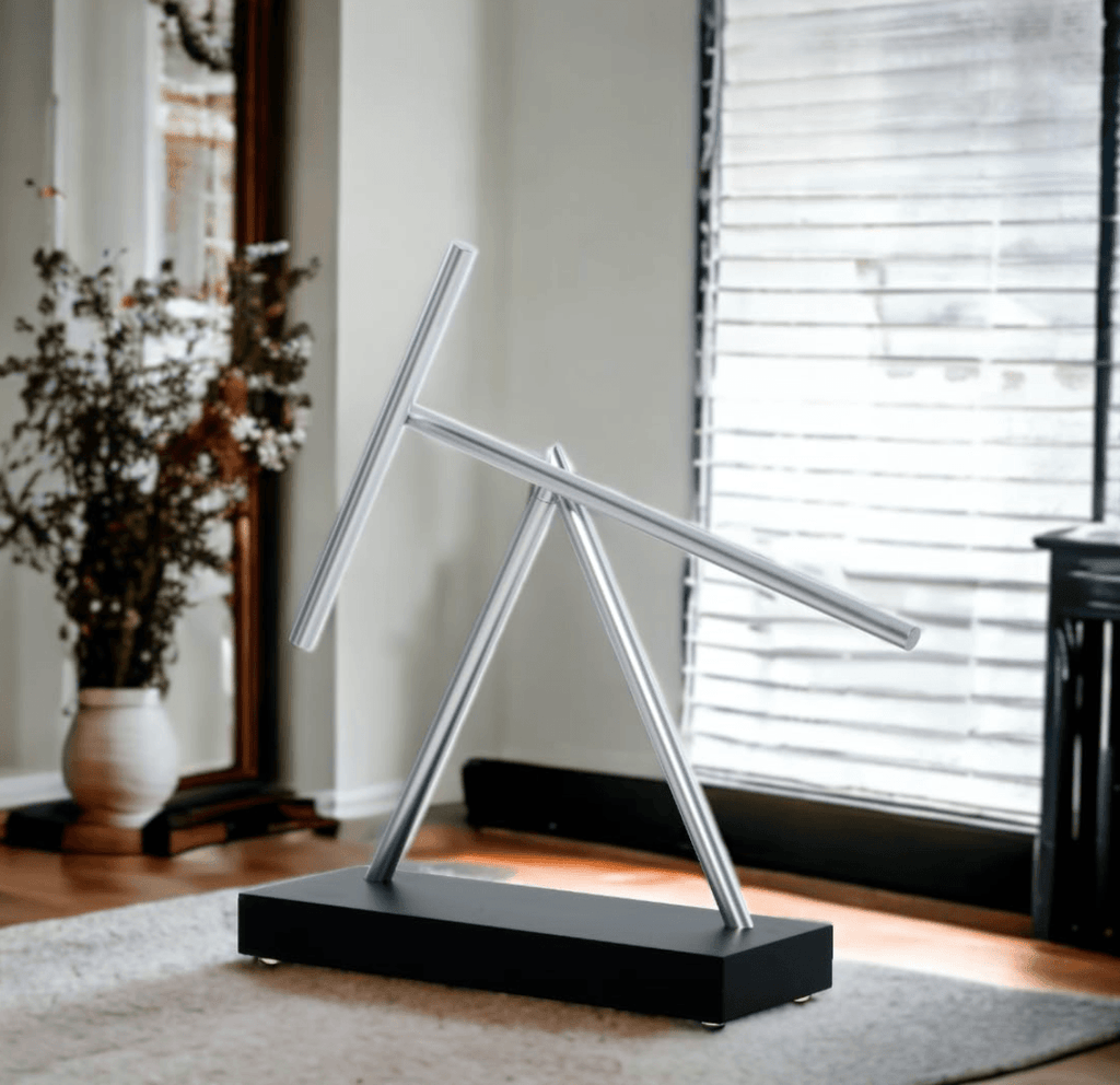 Perpetual motion desk sculpture gift for engineers, physics fans, and dads, a Black kinetic art piece for a work desk