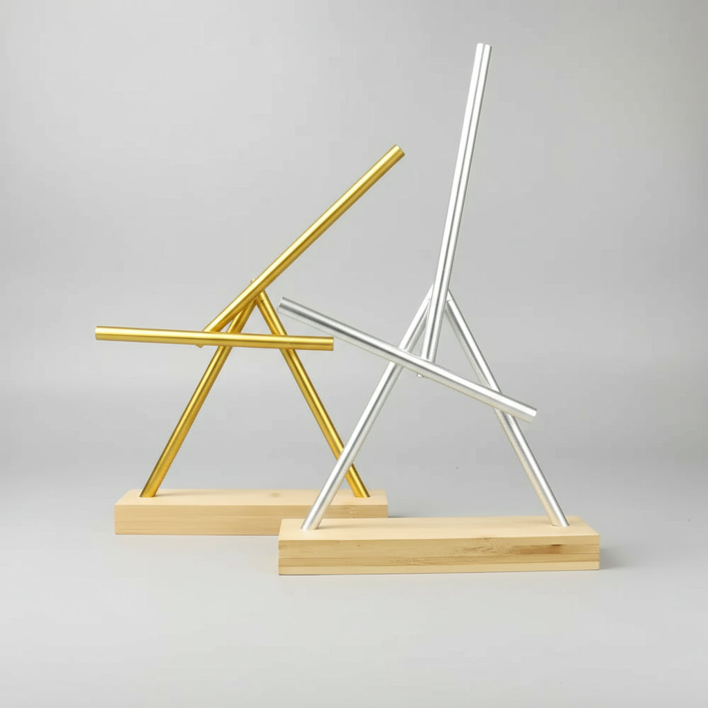Perpetual motion swinging sticks available in Gold and Silver finishes, a Newton pendulum desk gift for engineers and fans