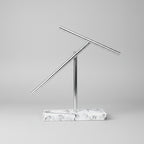 Newton pendulum kinetic sculpture with balanced aluminum arms and a White marble base, a physics gift for engineers