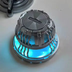Arc reactor housing casting a soft blue LED glow through its vents, an Iron Man MK3 night light and shelf display for fans
