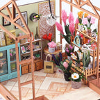 Miniature wooden greenhouse frame with tiered flower shelves and pampas blooms, a LED lit florist dollhouse desk decor
