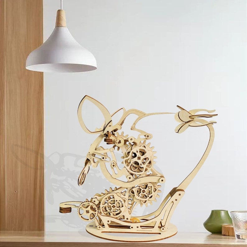 Wooden kinetic hummingbird model with a flower on a curved arm, mechanical sculpture for shelf and desktop display