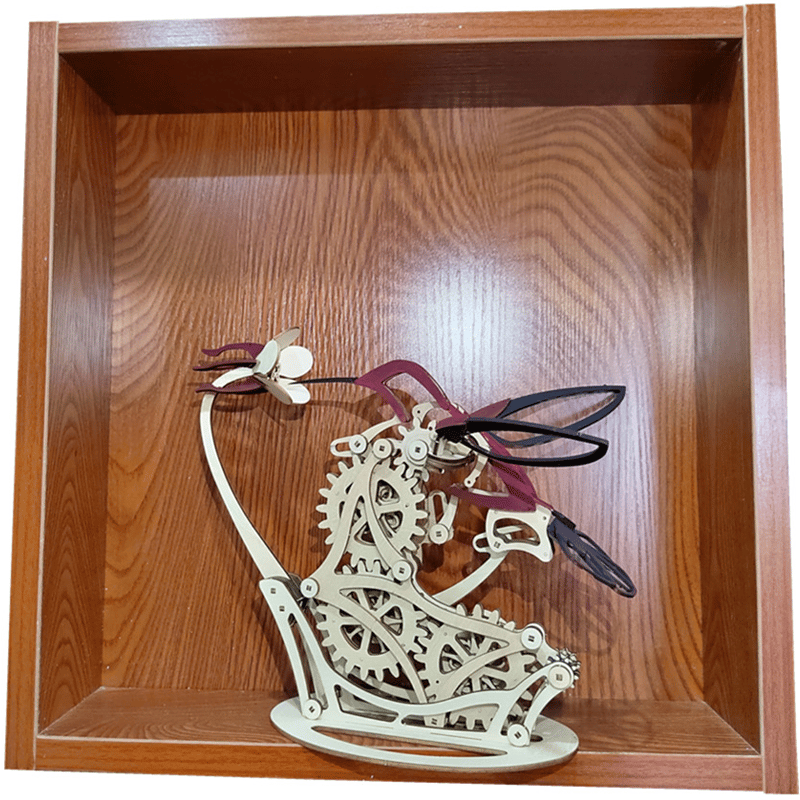 Kinetic hummingbird wood sculpture displayed in a shadow box, mechanical automata gift for engineers and hobbyists
