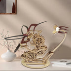 Wooden mechanical hummingbird automaton on a console shelf, kinetic desk sculpture for home and study decor