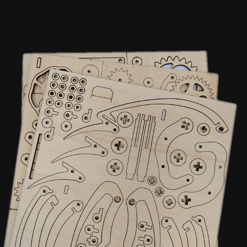 Laser-cut plywood parts for a 3D wooden hummingbird puzzle kit, tool-free no-glue assembly project for adults