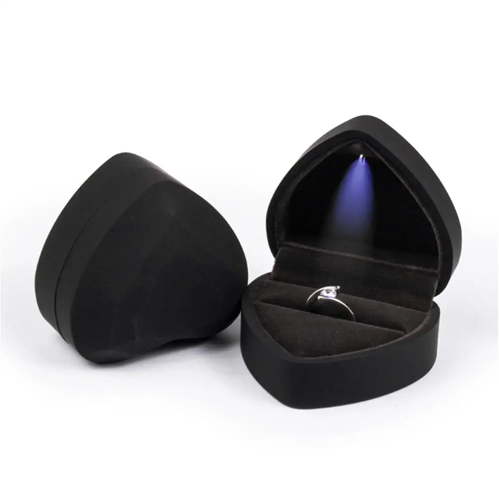 Black heart shaped LED ring box with diamond cut facets and automatic light for a dramatic evening proposal B-Black