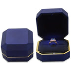 Blue octagonal LED engagement ring box with gold trim and a lit velvet cushion for a romantic proposal moment A-Blue