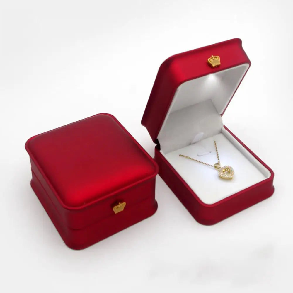 Red LED gift box with a lit interior holding a heart pendant necklace for a Valentine and anniversary gift E-Red-Necklace