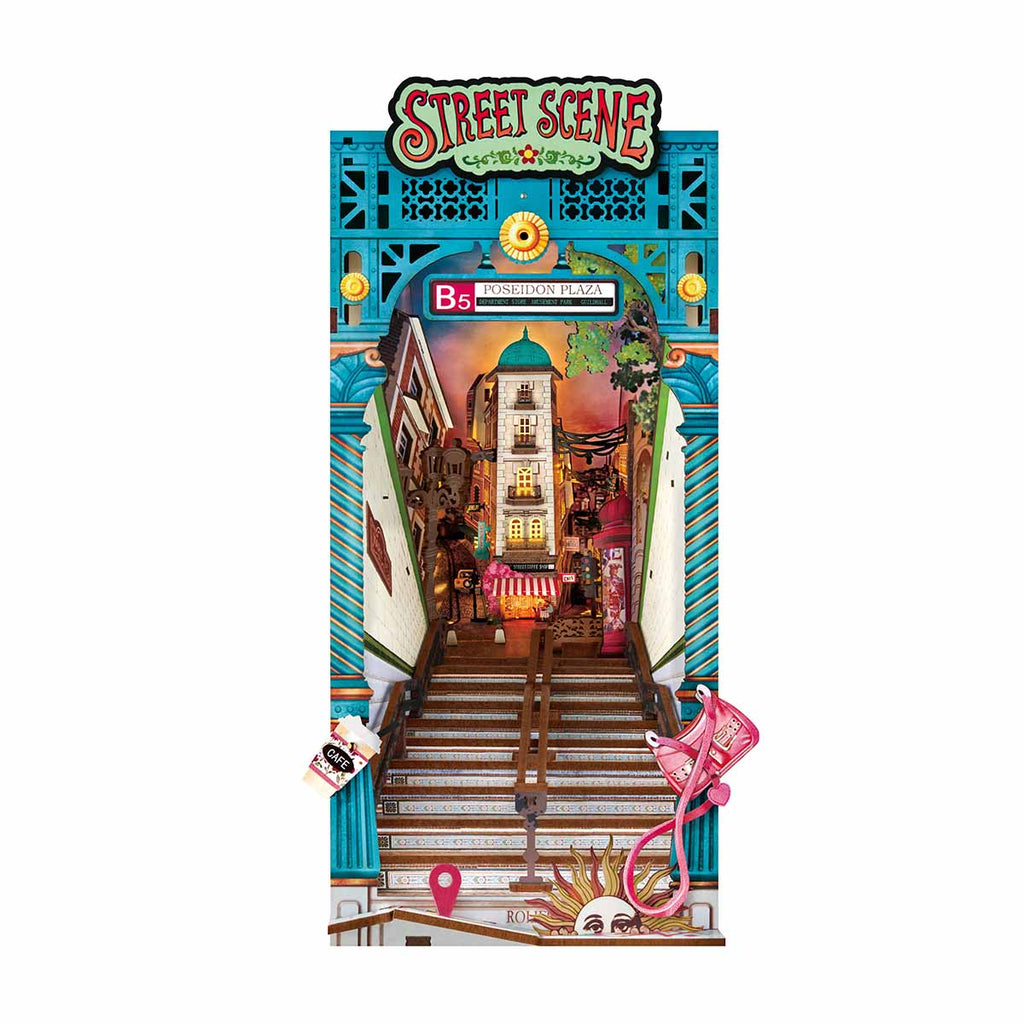 LED street scene book nook kit forming a lit miniature city diorama that slots between books as a bookshelf insert
