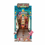 LED street scene book nook kit forming a lit miniature city diorama that slots between books as a bookshelf insert