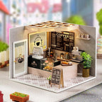 Miniature coffee shop dollhouse kit with barista counter, dessert case and a lit menu board for coffee lovers to build and display