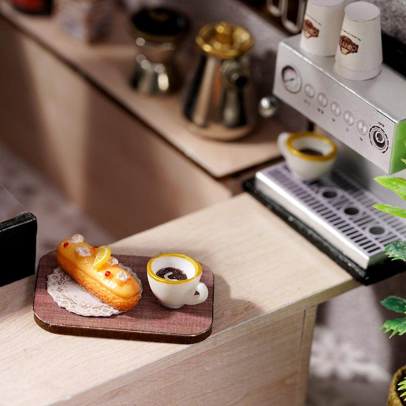 Little coffee shop treat scene with a glazed eclair and fresh brewed cup on a wood board, an appetizing accent for cafe decor