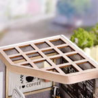 Wooden lattice ceiling of a miniature cafe kit showing precise assembly, a satisfying model building project for teens and adults