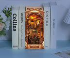 Lamplit miniature book nook shelf insert that slots between real books on a bookcase, a lit diorama for book lovers Magic Night Alley