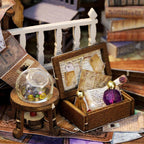 Whimsical Magic House miniature kit with tiny treasure chest, gemstone and scrolls, an illuminated wooden model as a craft gift
