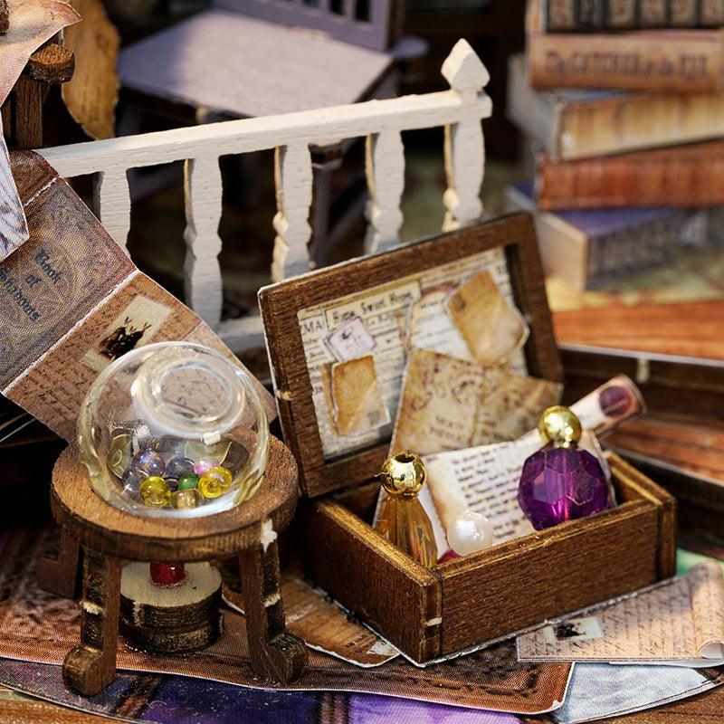 Whimsical Magic House miniature kit with tiny treasure chest, gemstone and scrolls, an illuminated wooden model as a craft gift