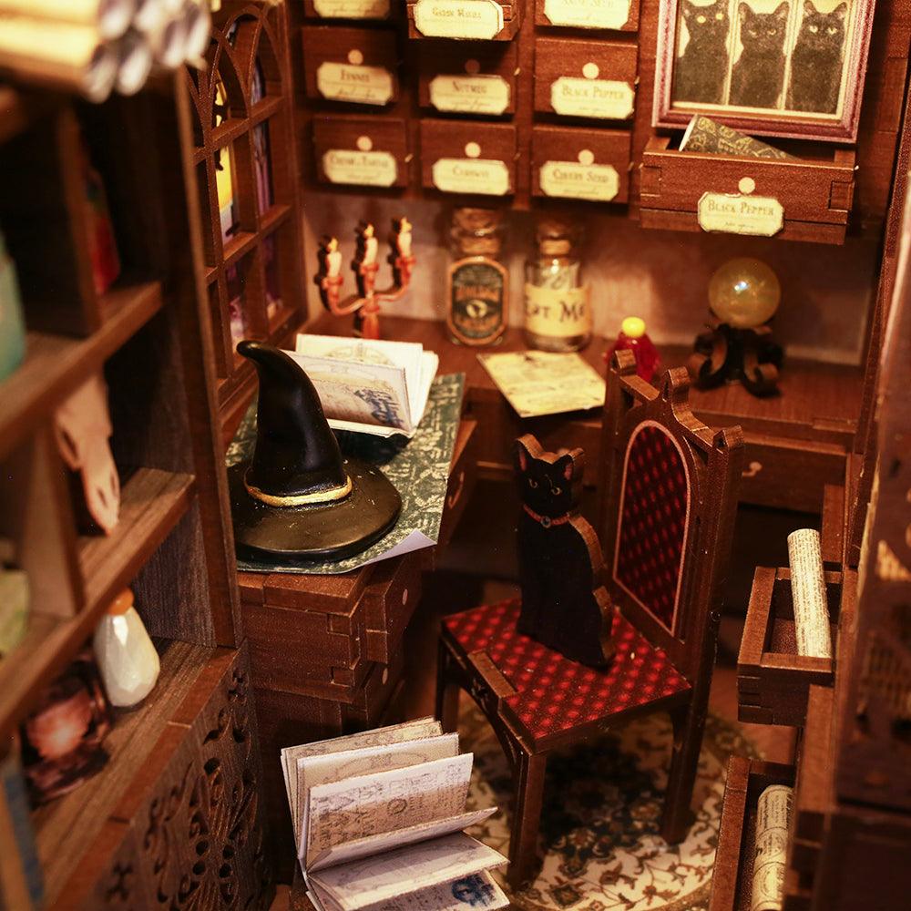 Miniature wizard study with a black cat and a pointed hat inside a lit book nook, a magical diorama craft for adult hobbyists Magic Pharmacist