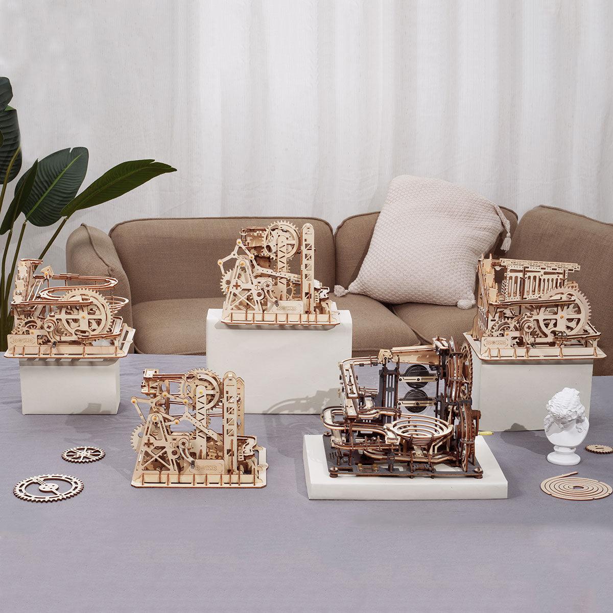 Wooden marble run collection of five STEM models including Funnel Parkour, Fortress Cascader and Marble Night City for teens and adults