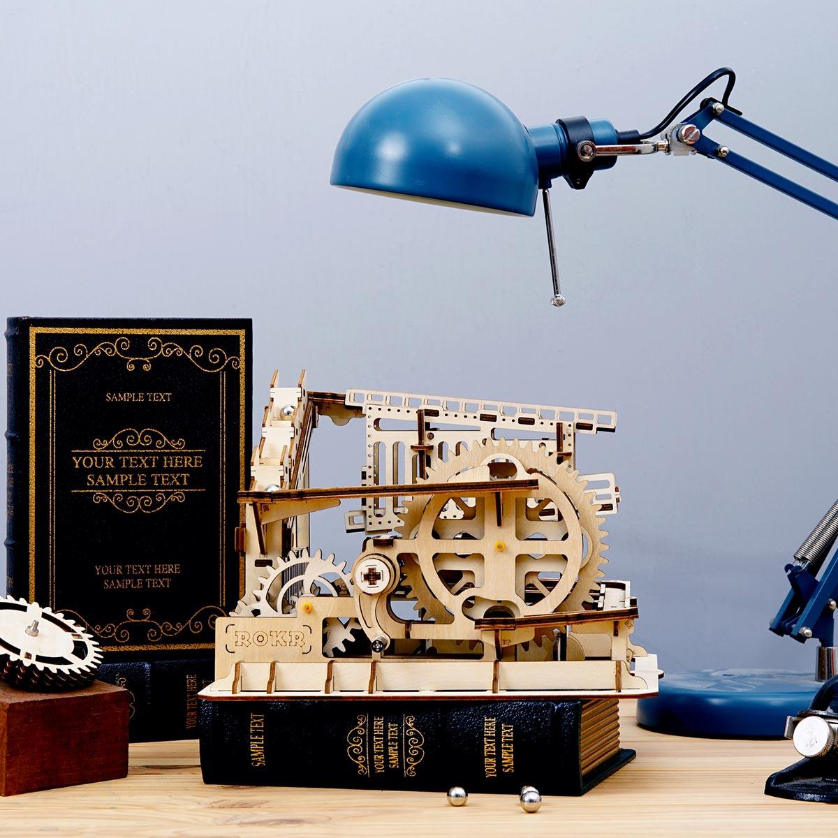 Swingback Explorer marble run with swingback rails, a crane lifter and spoked gears, a mechanical engineering kit for adults