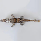 Articulated stainless steel crocodile model with a geared spine, an intermediate metal kit for hobbyists and collectors