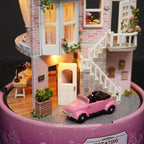 Pink brick townhouse facade miniature with a vintage car and white staircase for a handmade model building craft gift