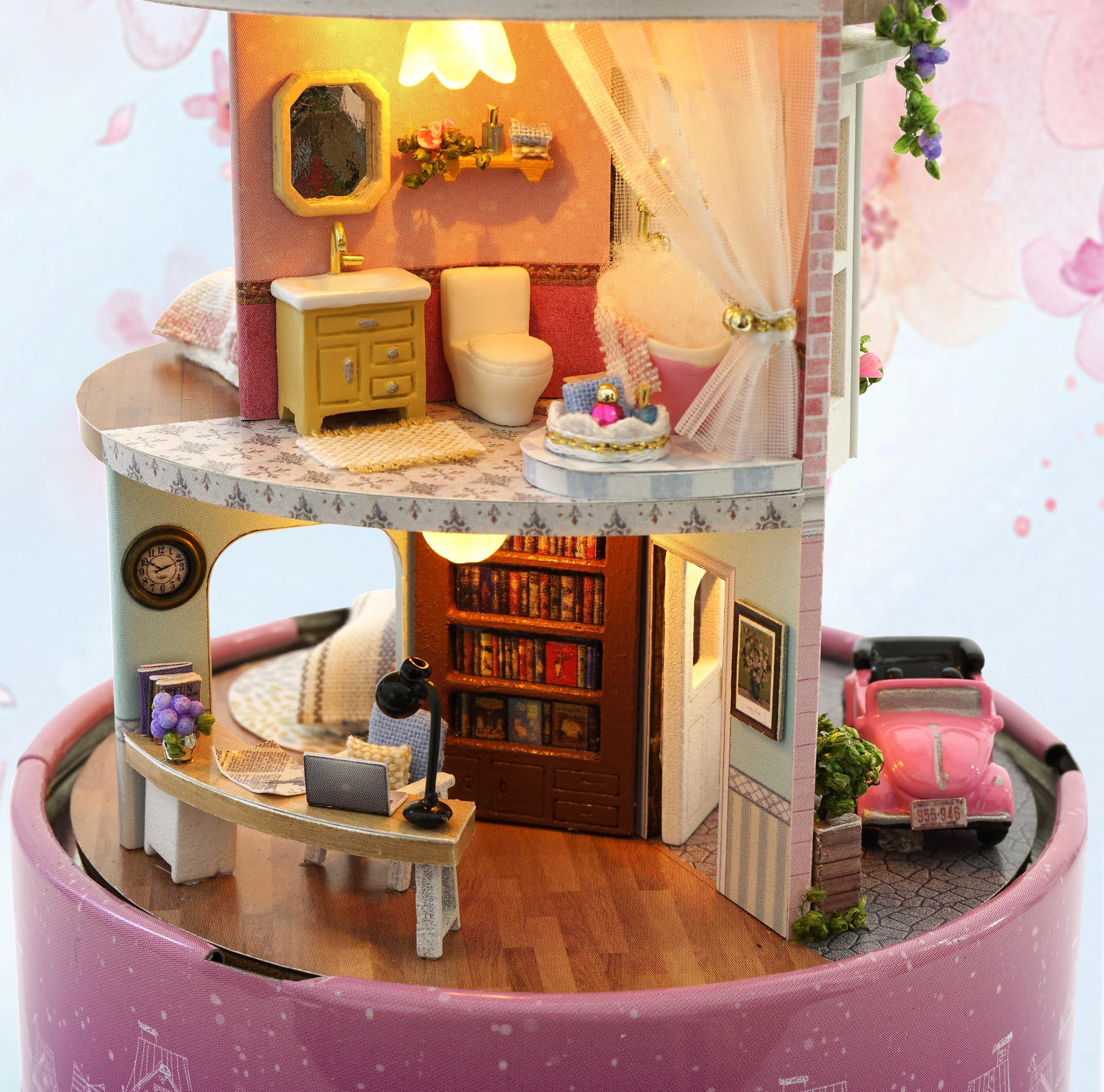 Miniature dollhouse kit interior with a book filled study desk and a bright bathroom for an adult 1:24 model build
