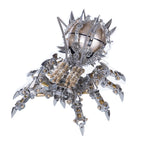 Articulated metal arachnid model with brass barrels and spiked legs, a 1000 piece steampunk speaker sculpture for shelf decor
