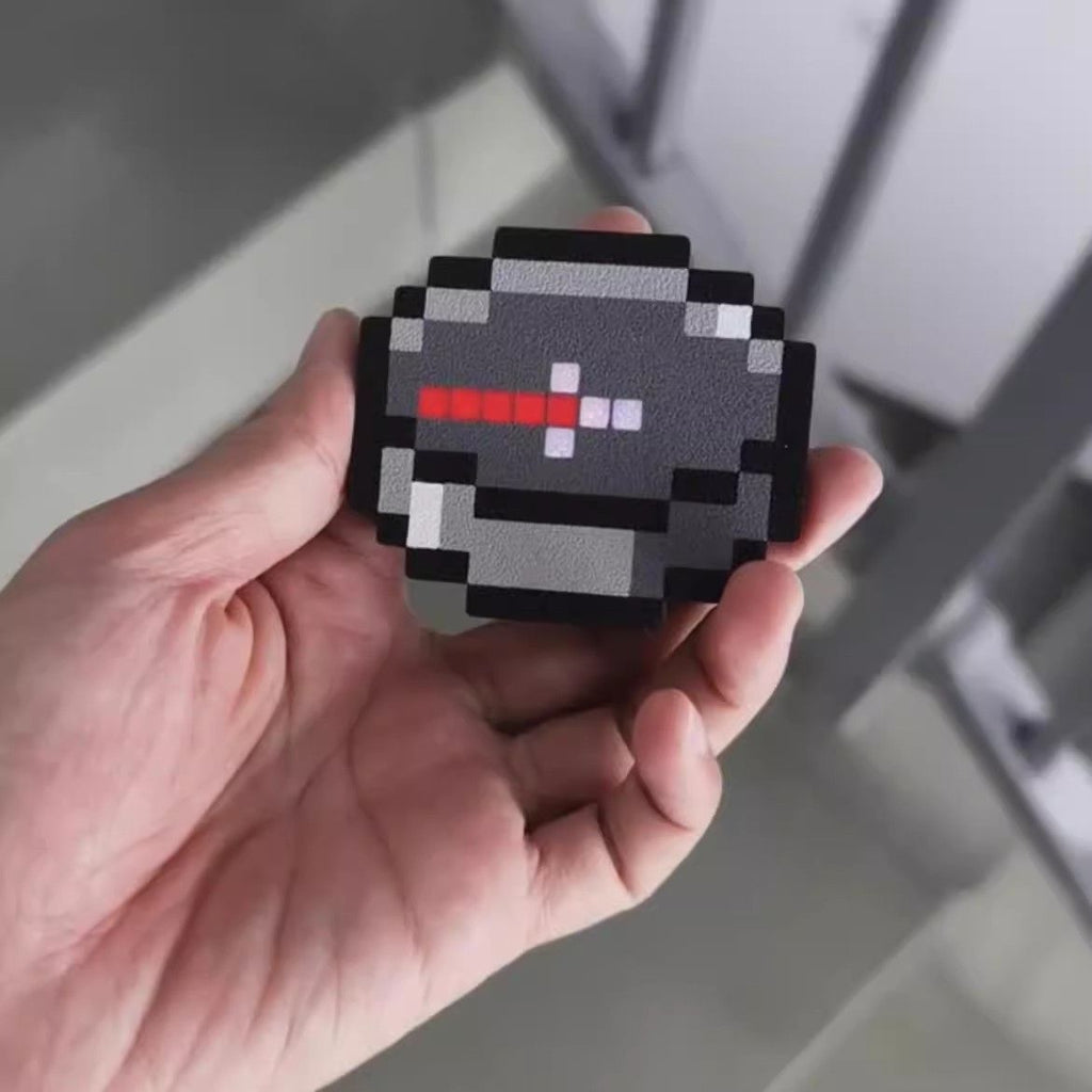 Pixel cube Minecraft compass with a red LED lit needle and 8-bit voxel frame for gaming desk decor and cosplay