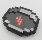 Hand sized Minecraft pixel compass as a car dashboard finder and desk ornament for gamers and outdoor explorers