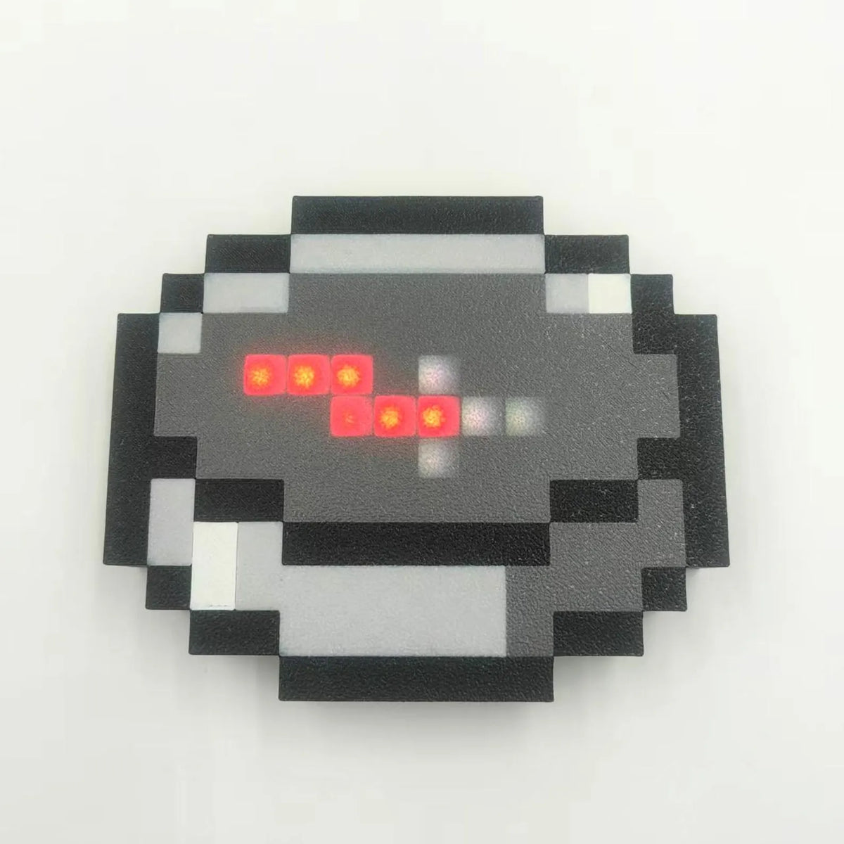 Portable Minecraft compass for camping and outdoor navigation with a red LED needle and pixelated cube design