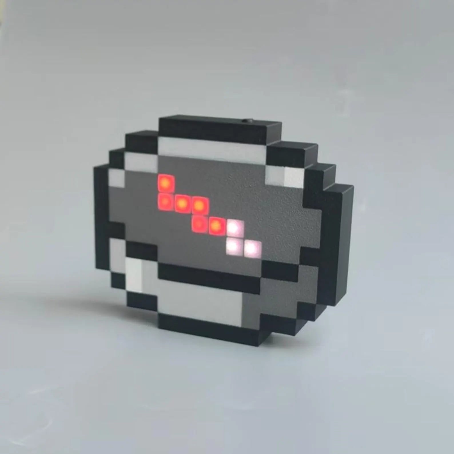 Minecraft pixel compass replica for gaming setup decor with USB-C charging and a glowing in-game style needle