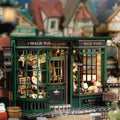 Miniature magic shop DIY building kit assembled as a lit 1:24 scale wizard potion shop, a booknook display for adult crafters
