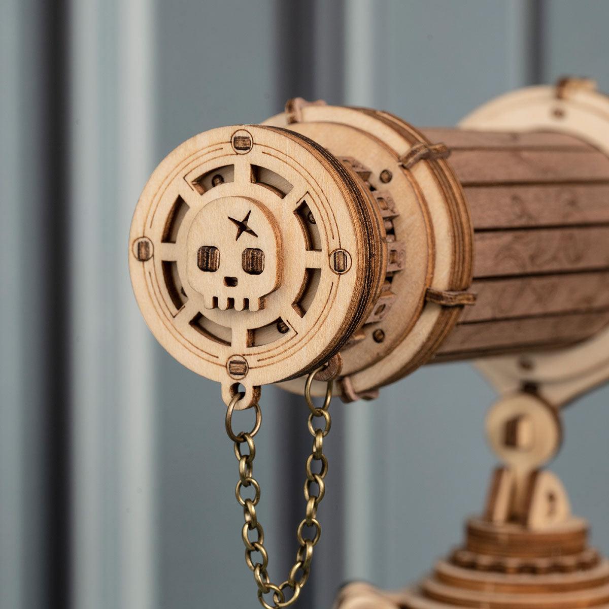 Carved wooden telescope end cap with nautical emblem and brass chain, a detailed model kit for collectors and decor