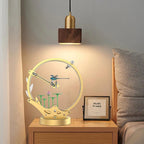 Dragonfly kinetic metal model on a bedroom nightstand, a motorized LED puzzle kit and decor gift for model collectors
