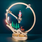 Santa Claus 3D metal puzzle glowing with color-changing LED lights, a motorized kinetic display for a desk or bookshelf