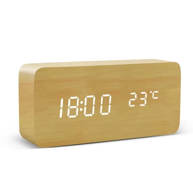 Bamboo wood digital alarm clock with a bright LED time and date display, a natural desk clock for a bedroom or home office