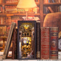 Space galaxy book nook kit that slots between books on a shelf with LED lighting for adult crafters and readers