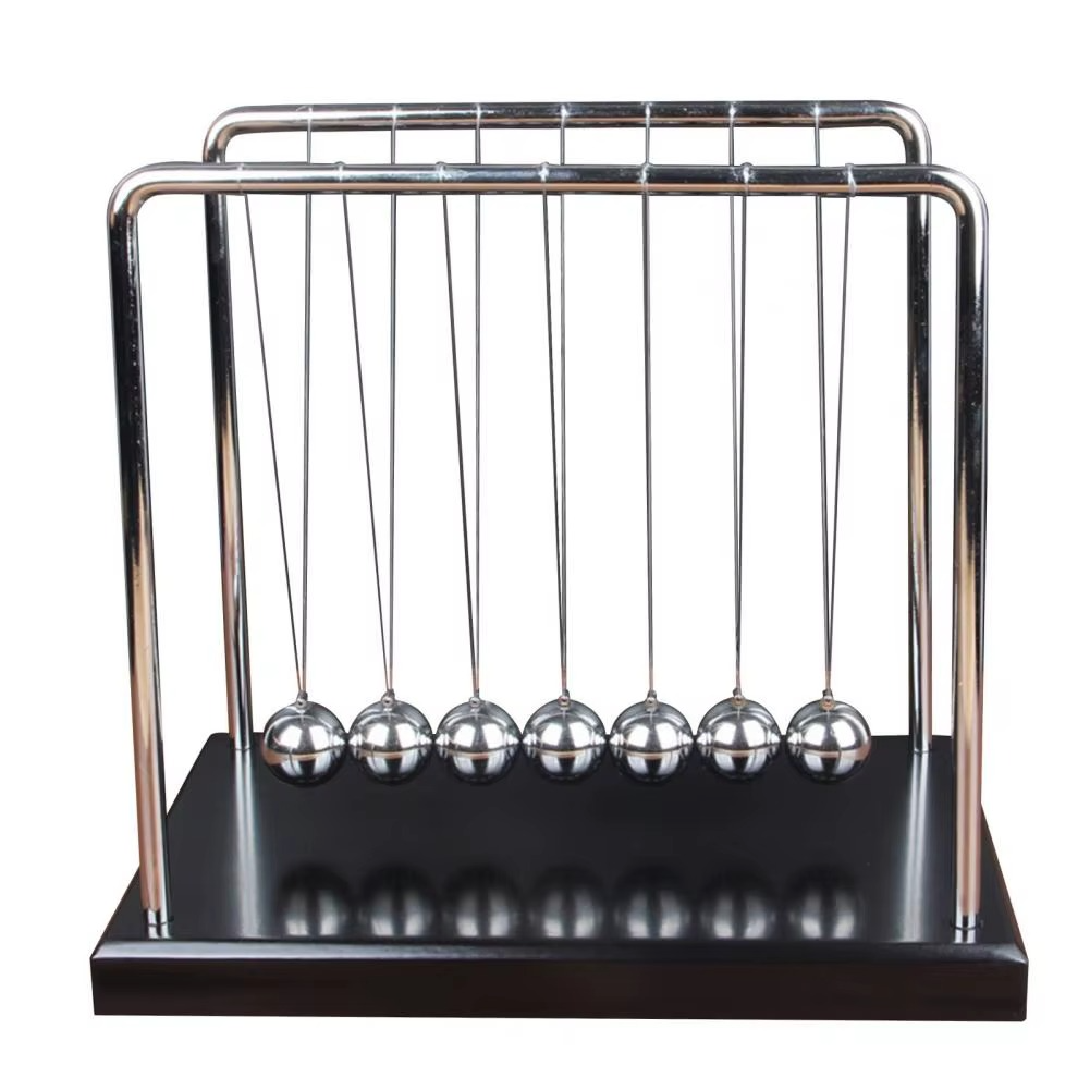 Newton's cradle kinetic desk toy with polished steel balls that swing to show momentum and energy on a red wood base (fits SKU_1748792312012_64)