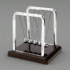 Newton's cradle with a red wood base and chrome arms as a sleek desktop kinetic ornament and momentum demonstrator (fits SKU_1748792312012_64)