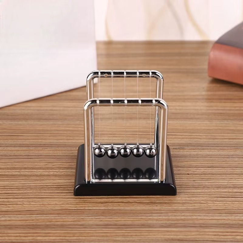 Executive desk toy Newton's cradle with a black base and steel balls for office decor and a calming break at work (fits SKU_1748792312012_490, SKU_1748792312012_491)