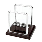 Steel ball balance toy on a black base that offers quiet stress relief and a focus aid for a busy office desk (fits SKU_1748792312012_490, SKU_1748792312012_491)